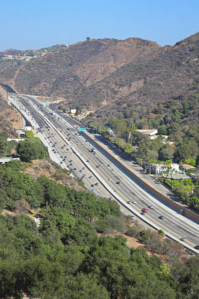Highway 405 - Los Angeles Interstate 405 is a north–south highway in Southern California running along the western and southern parts of Los Angeles from Irvine to San Fernando. It is a heavily traveled and is the most congested freeway in the United. It crosses over the Sepulveda Pass in the Santa Monica Mountains. san diego freeway stock pictures, royalty-free photos & images