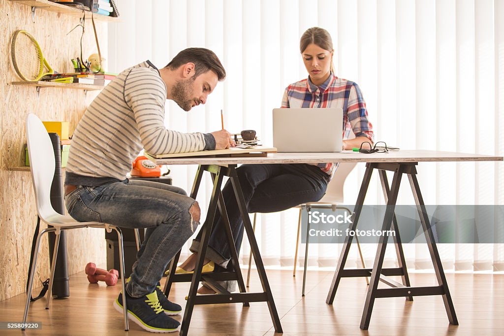 Artists drawing, working at modern office Animator Stock Photo