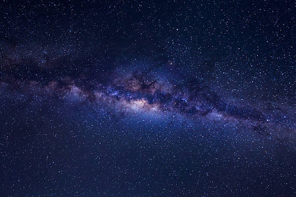 istock Milky way with stars and space dust on night sky. 525809310
