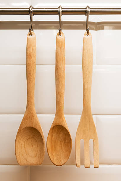 istock Wood ladles hanging on wall, kitchen concept. 525810116