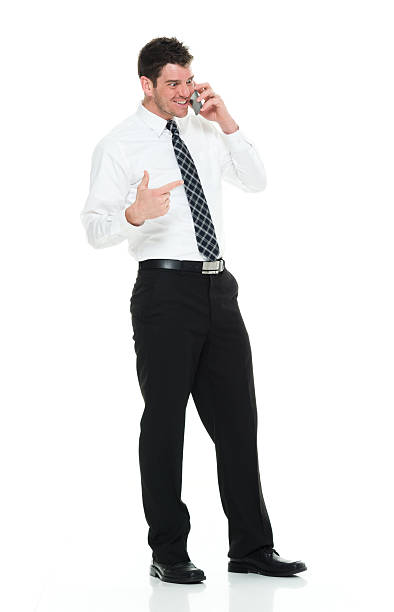 istock Smiling businessman talking on phone 525812060