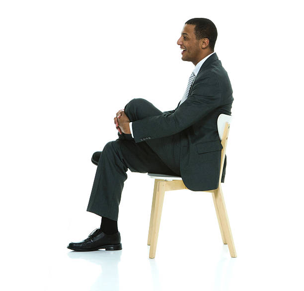istock Cheerful businessman sitting on chair 525812242