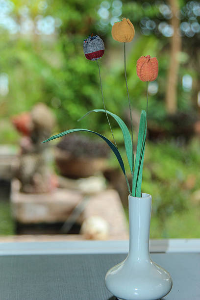 istock Artificial flowers and blur garden background 525812310