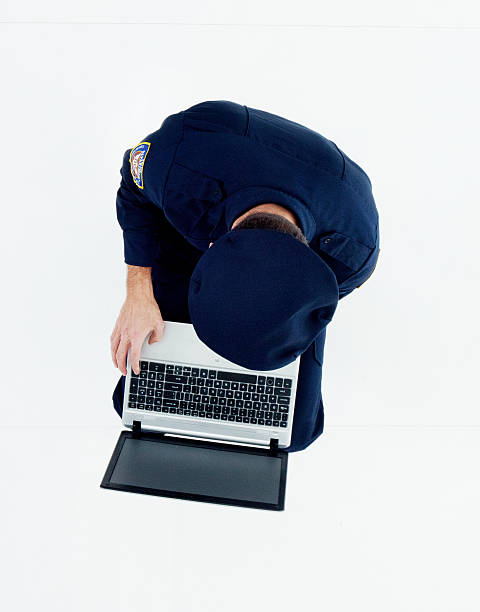 istock Above view of police working on laptop 525812846