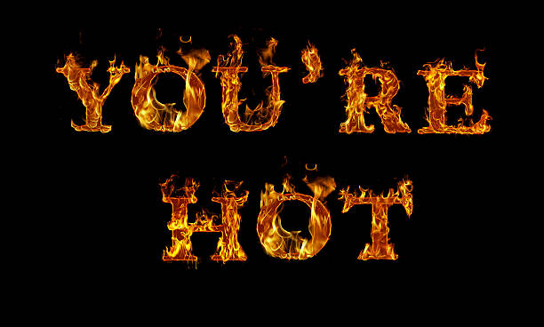istock YOU'RE HOT written with burning letters in flame 525813390