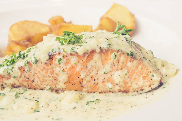 istock salmon steak cream sauce 525814254