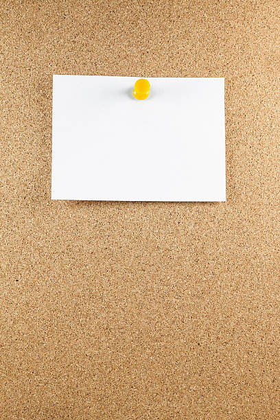 istock Blank white note papers is pinned to a cork board. 525827479