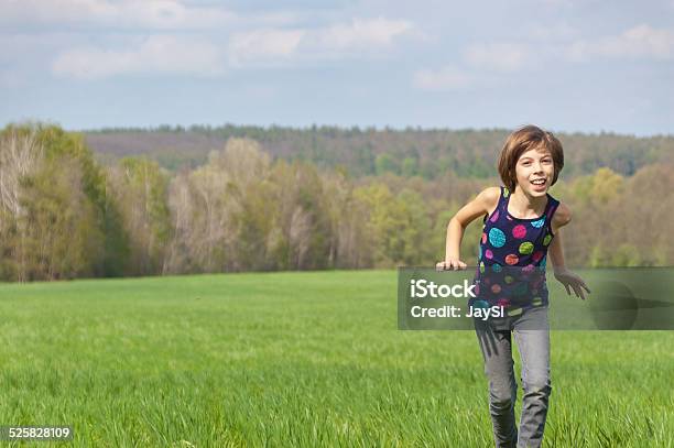 Happy Active Girl Running On Green Field Stock Photo - Download Image Now - Activity, Agricultural Field, Beautiful People