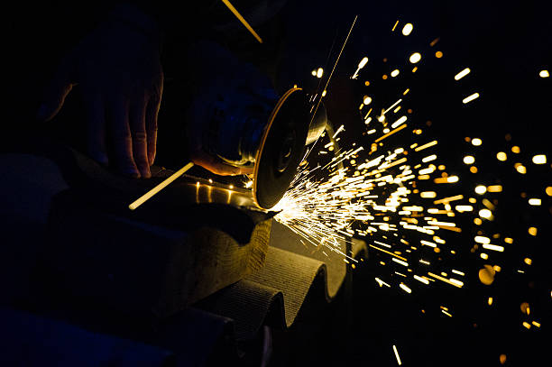 istock Metal grinding on steel pipe close up 525828853