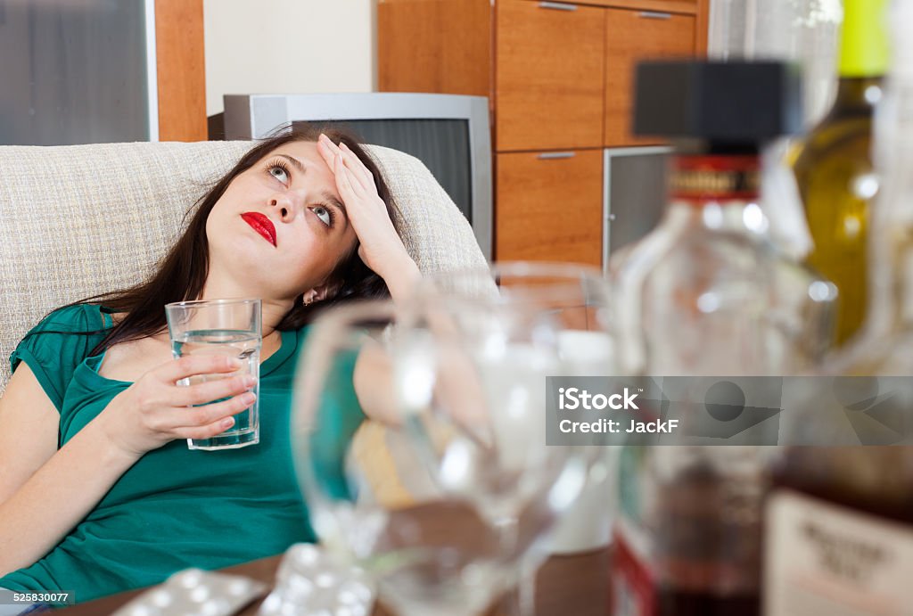 woman having hangover woman having hangover after celebrating of holiday Adult Stock Photo
