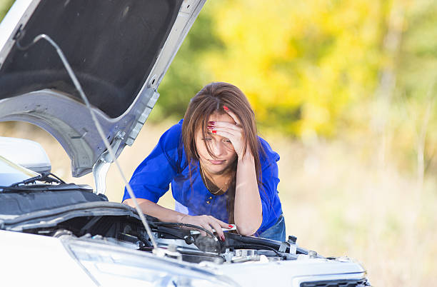 A woman having problems with her car