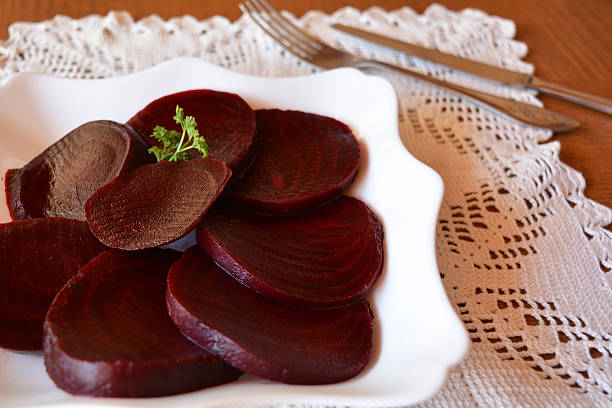 istock Sliced beet root salad on the white plate 525831481