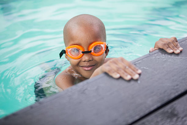 istock Little boy smiling in the pool 525832055