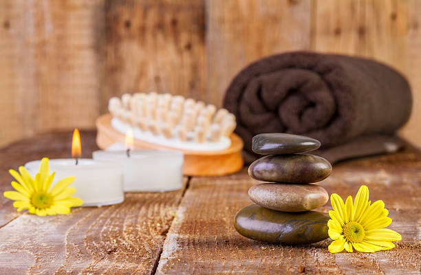 istock Zen basalt stones and spa oil with candles 525832077