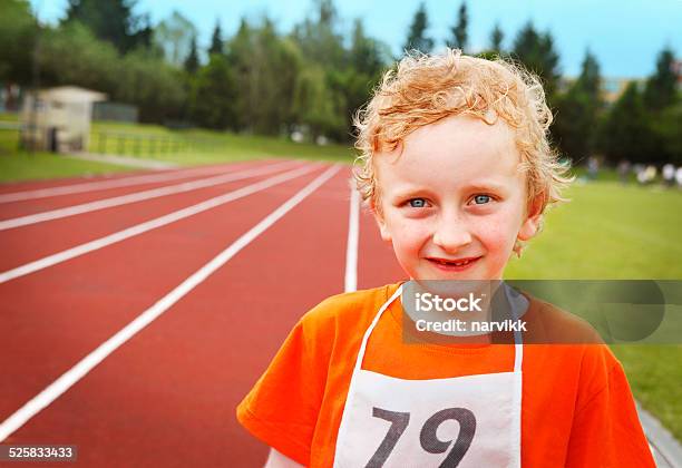 Little Athlete At Running Track Stock Photo - Download Image Now - Activity, Athlete, Blond Hair