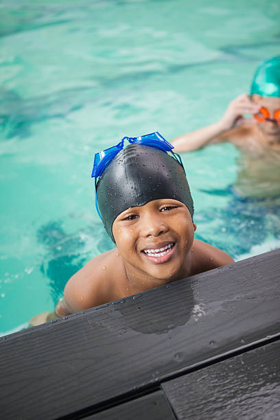 istock Little boys smiling in the pool 525834195