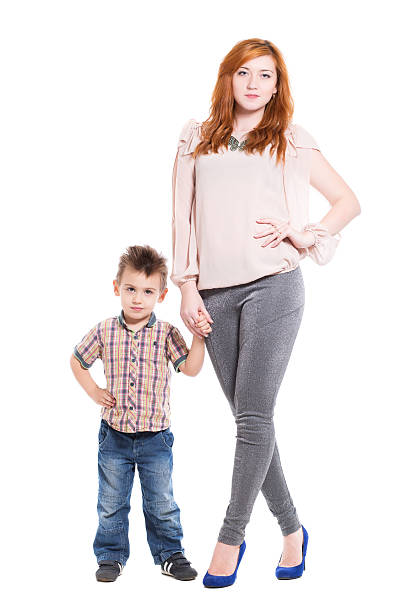 istock Young redhead woman posing with her little son 525834271