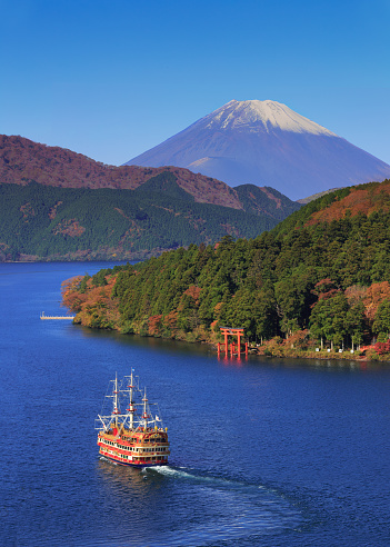 Mountain Fuji and Lake Ashi with Hakone temple and sightseeing cruise boat in autumn
