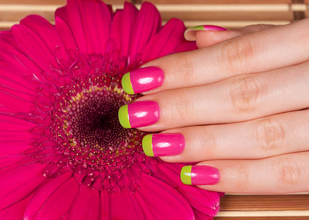 istock Beautiful female hand with two-color manicure 525834747