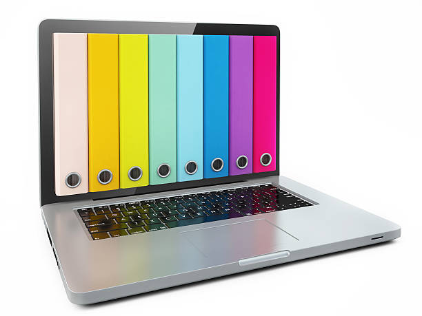 istock Concept with Laptop and Color Binders Isolated on White Background 525835277