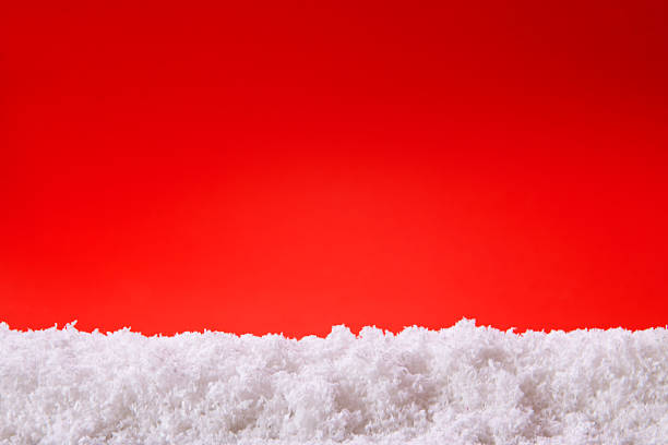 istock Red christmas background and white snow. 525835389