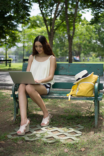 istock Woman using laptop in garden 525835423