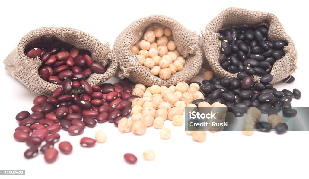 beans yellow peas and kidney beans in a sack on white background Agriculture Stock Photo