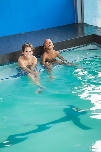 istock Little boys sitting in the pool 525859623
