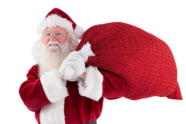 istock Santa carries his red bag and smiles 525860435