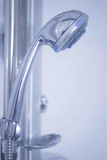 istock Domestic bathroom shower head close-up in blue 525862175