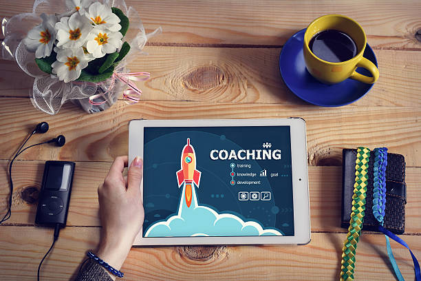 istock Laptop computer, tablet pc and Coaching design concept on wooden 525873988