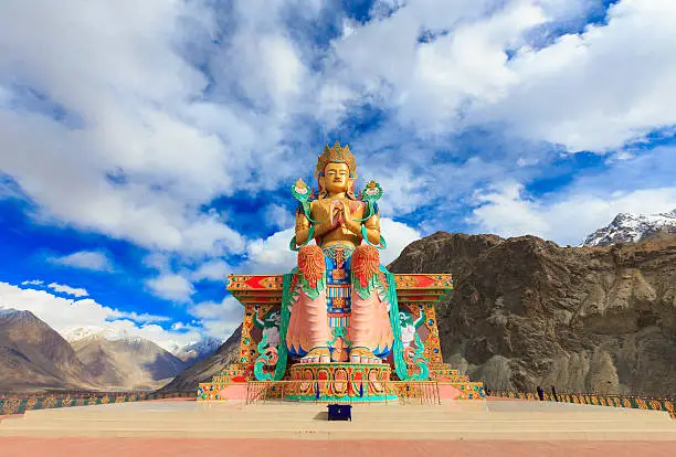 Big statue of Maitreya Buddha near Diskit Monastery in Nubra Valley, Jammu and Kashmir, India. This impressive 32 metre (106 foot) statue on top of a hill below the monastery, faces down the Shyok River towards Pakistan.