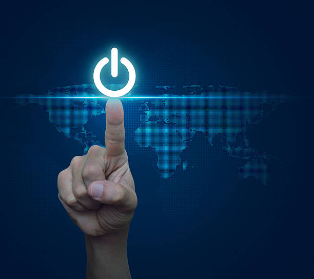 istock Pressing power button, Elements of this image furnished by NASA 525875310