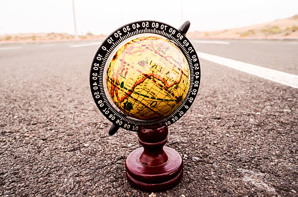istock Globe Earth on an Asphalt Street 525875374