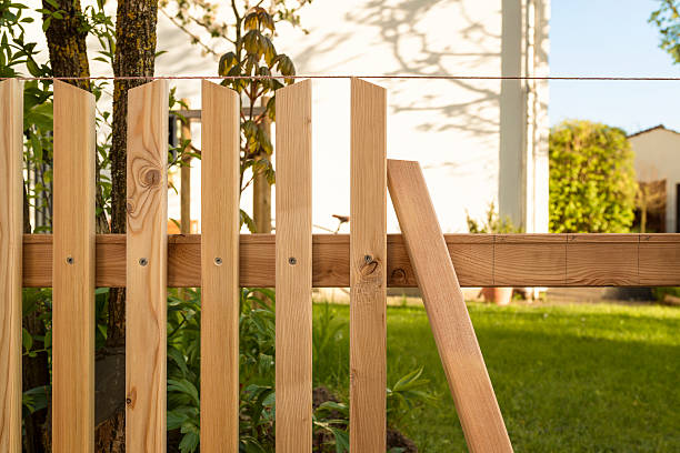 istock building a wooden fence 525875530