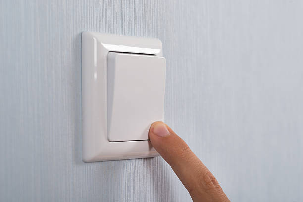 istock Close-up Of Hand Pressing Switch 525876000