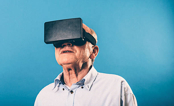 VR glasses gives senior man immersive experience stock photo