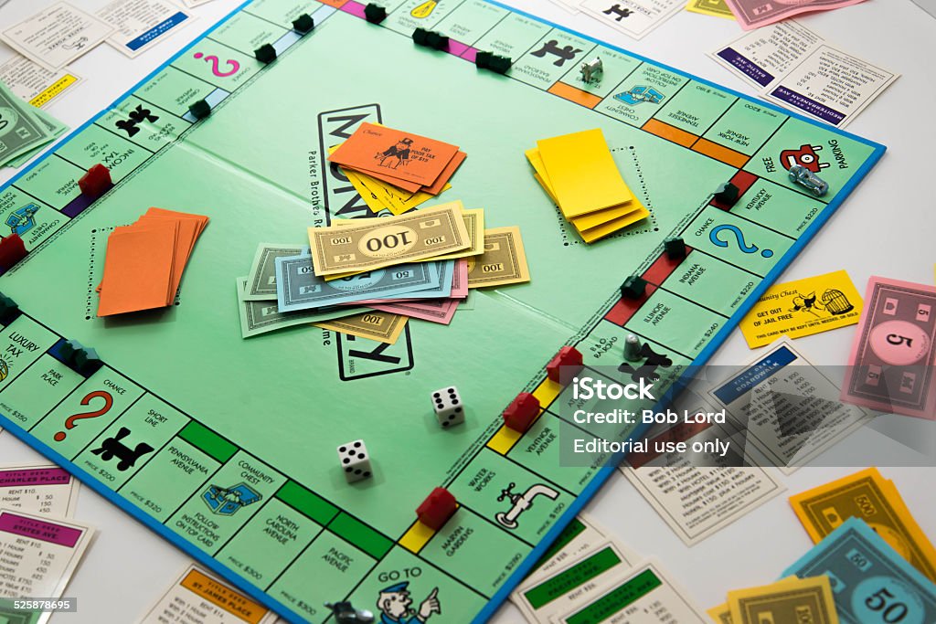 Monopoly game in play - money, dice, pieces and cards - Royalty-free Monopoly - Board Game Stockfoto
