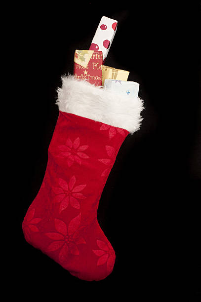 istock Colorful red Christmas stocking with gifts 525878902