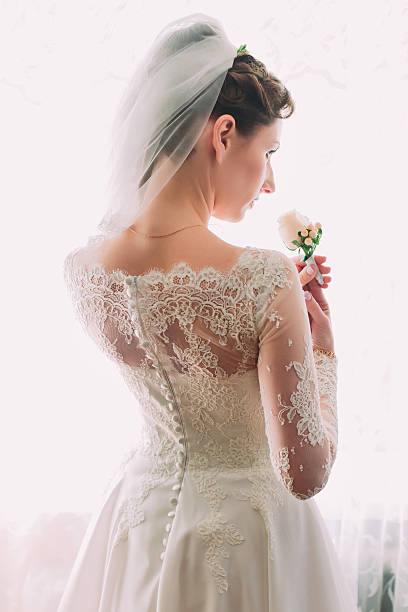 istock Elegant young and dreamy beautiful bride in a luxurious lace 525878964