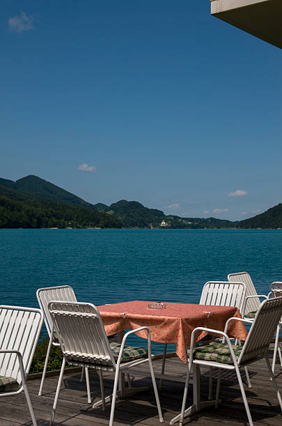 istock Table and chairs at the lake 525878969