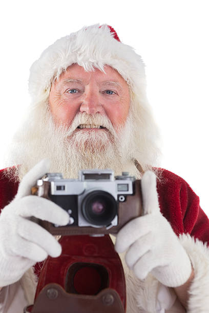 istock Santa is taking a picture 525879797