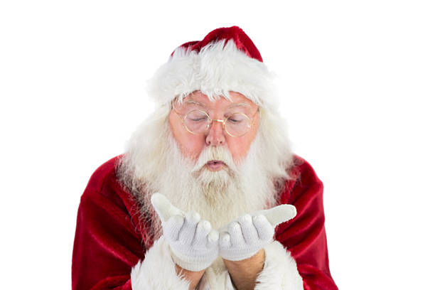 istock Santa Claus blows something away 525880391