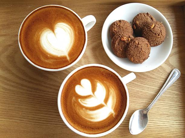 istock Latte art coffee so delicious on wood background 525880732
