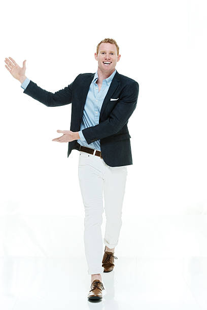 istock Cheerful fashionable man presenting 525881201