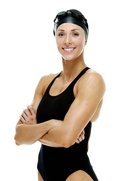 Smiling swimmer standing with arms crossed