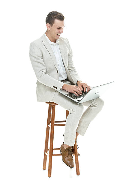 istock Cheerful smart casual man working on laptop 525881521
