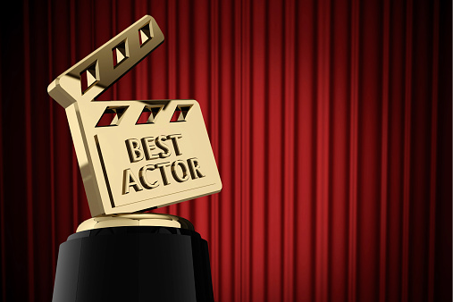 Gold movie film slate trophy with the word best actor on the front