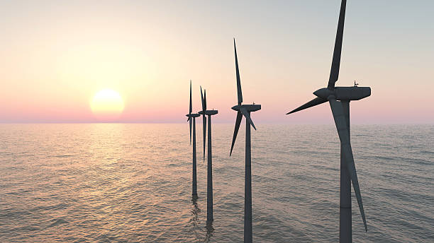 Offshore wind farm at sunset Computer generated 3D illustration with offshore wind turbines at sunset offshore wind farm stock pictures, royalty-free photos & images
