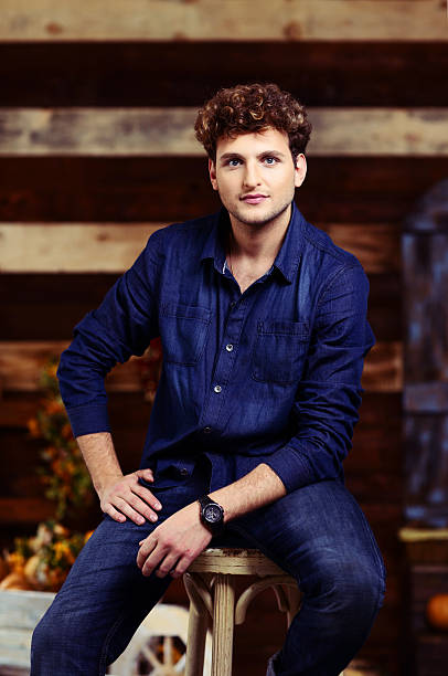 istock handsome man sitting on the chair 525882649